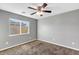 Comfortable bedroom featuring a large window overlooking the neighborhood at 514 W Desert Ln, Phoenix, AZ 85041