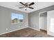 Bedroom featuring neutral paint, carpet, closet, and natural light from the window at 514 W Desert Ln, Phoenix, AZ 85041