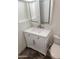 Bathroom features a vanity with a white countertop, a mirror, and a toilet at 5228 N 15Th Dr, Phoenix, AZ 85015