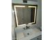 Bathroom vanity with sink and lighted mirror at 5228 N 15Th Dr, Phoenix, AZ 85015