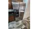 Stainless steel refrigerator features a water and ice dispenser with granite countertops at 5228 N 15Th Dr, Phoenix, AZ 85015