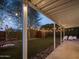 Shot of a backyard featuring a swingset, ambient lights, and manicured landscaping at 6114 N 8Th St, Phoenix, AZ 85014