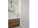 Bright bathroom with a modern vanity, square sink, and a sleek, tiled shower in a minimalist design at 6114 N 8Th St, Phoenix, AZ 85014