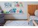 Charming bedroom with a cozy chair, soft rug, and a bookshelf filled with a collection of delightful storybooks at 6114 N 8Th St, Phoenix, AZ 85014