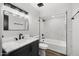 This remodeled bathroom features a marble countertop vanity, modern fixtures, and a shower/tub combination at 6207 N 10Th Way, Phoenix, AZ 85014