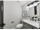 Light and bright bathroom with stylish vanity, marble countertop, modern fixtures and patterned floor at 6207 N 10Th Way, Phoenix, AZ 85014