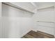 This closet is lined with wooden rods and laminate flooring at 6207 N 10Th Way, Phoenix, AZ 85014