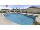 Large, inviting community pool surrounded by concrete and well-maintained landscaping at 6207 N 10Th Way, Phoenix, AZ 85014