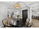 Bright dining room with natural lighting, stylish wicker chairs, and seamlessly attached kitchen at 6207 N 10Th Way, Phoenix, AZ 85014