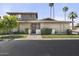 Traditional home featuring a brick facade, manicured lawn, mature trees, and a welcoming front entrance at 6207 N 10Th Way, Phoenix, AZ 85014