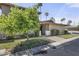 Charming single-story home with a brick facade, green lawn, and mature landscaping at 6207 N 10Th Way, Phoenix, AZ 85014