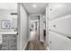 Bright hallway leading to living room and bathroom with storage cabinets at 6207 N 10Th Way, Phoenix, AZ 85014