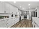 Bright, modern kitchen with stainless steel appliances and a statement backsplash offers a great cooking experience at 6207 N 10Th Way, Phoenix, AZ 85014