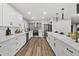 Bright, modern kitchen with stainless steel appliances and a statement backsplash offers a great cooking experience at 6207 N 10Th Way, Phoenix, AZ 85014