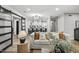 Inviting living area featuring comfortable seating and an open view of the modern kitchen with island seating at 6207 N 10Th Way, Phoenix, AZ 85014