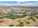 Panoramic view of a golf course community, highlighting the serene lakes and greens at 6450 S Windstream Pl, Chandler, AZ 85249