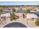 Wide aerial shot of cozy home with a desert landscaped yard in a quiet residential neighborhood at 6450 S Windstream Pl, Chandler, AZ 85249