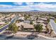 Wide residential aerial highlights the neighborhood's lush greenery, sidewalks, and private backyards at 6450 S Windstream Pl, Chandler, AZ 85249