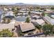 Wide aerial view showcases the properties desert landscaping and mountain backdrop at 6450 S Windstream Pl, Chandler, AZ 85249