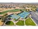 Aerial view of community, showcasing tennis courts, golf course, and scenic landscaping at 6450 S Windstream Pl, Chandler, AZ 85249