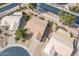 Aerial view showcases the beautiful desert landscaping and a terra cotta tile roof at 6450 S Windstream Pl, Chandler, AZ 85249