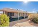 View of a backyard featuring gravel landscaping, desert plants, and a covered patio at 6450 S Windstream Pl, Chandler, AZ 85249