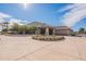 View of community clubhouse featuring desert landscaping and covered entry with fountain at 6450 S Windstream Pl, Chandler, AZ 85249