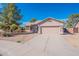 Charming single-story home boasts a well-maintained yard and a spacious two-car garage at 6450 S Windstream Pl, Chandler, AZ 85249