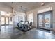 Bright fitness center entrance with tile flooring and exercise equipment, creating an inviting space at 6450 S Windstream Pl, Chandler, AZ 85249