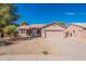 Charming single-story home with a well-maintained front yard and two-car garage at 6450 S Windstream Pl, Chandler, AZ 85249