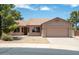 Inviting single-story home featuring mature trees and a two-car garage at 6450 S Windstream Pl, Chandler, AZ 85249