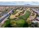 Beautiful aerial view of a golf course surrounded by homes and green grass at 6450 S Windstream Pl, Chandler, AZ 85249