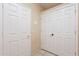 Hallway featuring multiple white doors and neutral walls, offering privacy and storage at 6450 S Windstream Pl, Chandler, AZ 85249