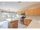 Well-lit kitchen with stainless steel appliances and a center island at 6450 S Windstream Pl, Chandler, AZ 85249