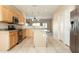 Bright, open kitchen with stainless steel appliances and light wood cabinets at 6450 S Windstream Pl, Chandler, AZ 85249