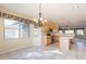 Open concept kitchen and dining area with a chandelier and lots of natural light at 6450 S Windstream Pl, Chandler, AZ 85249