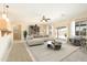 Inviting living room with comfortable seating, stylish decor, sliding glass doors to the outdoors, and neutral color palette at 6450 S Windstream Pl, Chandler, AZ 85249