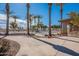 Relaxing community pool area with shaded seating and lush landscaping at 6450 S Windstream Pl, Chandler, AZ 85249