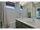 Well-lit bathroom with double vanity sinks, ample counter space, and a shower-tub combination at 6614 W Victory N Way, Florence, AZ 85132