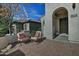 Cozy front porch with a brick patio, perfect for relaxing and enjoying the outdoors at 6614 W Victory N Way, Florence, AZ 85132