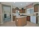 Cozy eat-in kitchen featuring an island, modern appliances, and plenty of cabinet space at 6614 W Victory N Way, Florence, AZ 85132