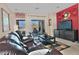 Living room featuring a large sofa and a sliding glass door at 6614 W Victory N Way, Florence, AZ 85132