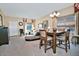 Open-concept living and dining area with neutral colors and lots of natural light at 6614 W Victory N Way, Florence, AZ 85132