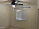 Bedroom with ceiling fan and window at 7551 W Pasadena Ave, Glendale, AZ 85303