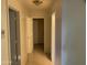 Hallway with doors to other rooms and tile floors at 7551 W Pasadena Ave, Glendale, AZ 85303