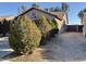 Well-manicured landscaping and side access to the backyard of the home at 7551 W Pasadena Ave, Glendale, AZ 85303