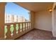 Balcony with ornate railing and views of nearby apartment complex and lawn at 7950 E Camelback Rd # 310, Scottsdale, AZ 85251