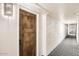 Hallway with patterned carpet leading to unit 310 at 7950 E Camelback Rd # 310, Scottsdale, AZ 85251