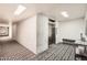 Hallway view with textured wall and a bench beside the elevator at 7950 E Camelback Rd # 310, Scottsdale, AZ 85251