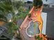 Aerial view of a private backyard oasis with a pool, lounge chairs, and a cozy fire pit area at 8037 W Sweetwater Ave, Peoria, AZ 85381